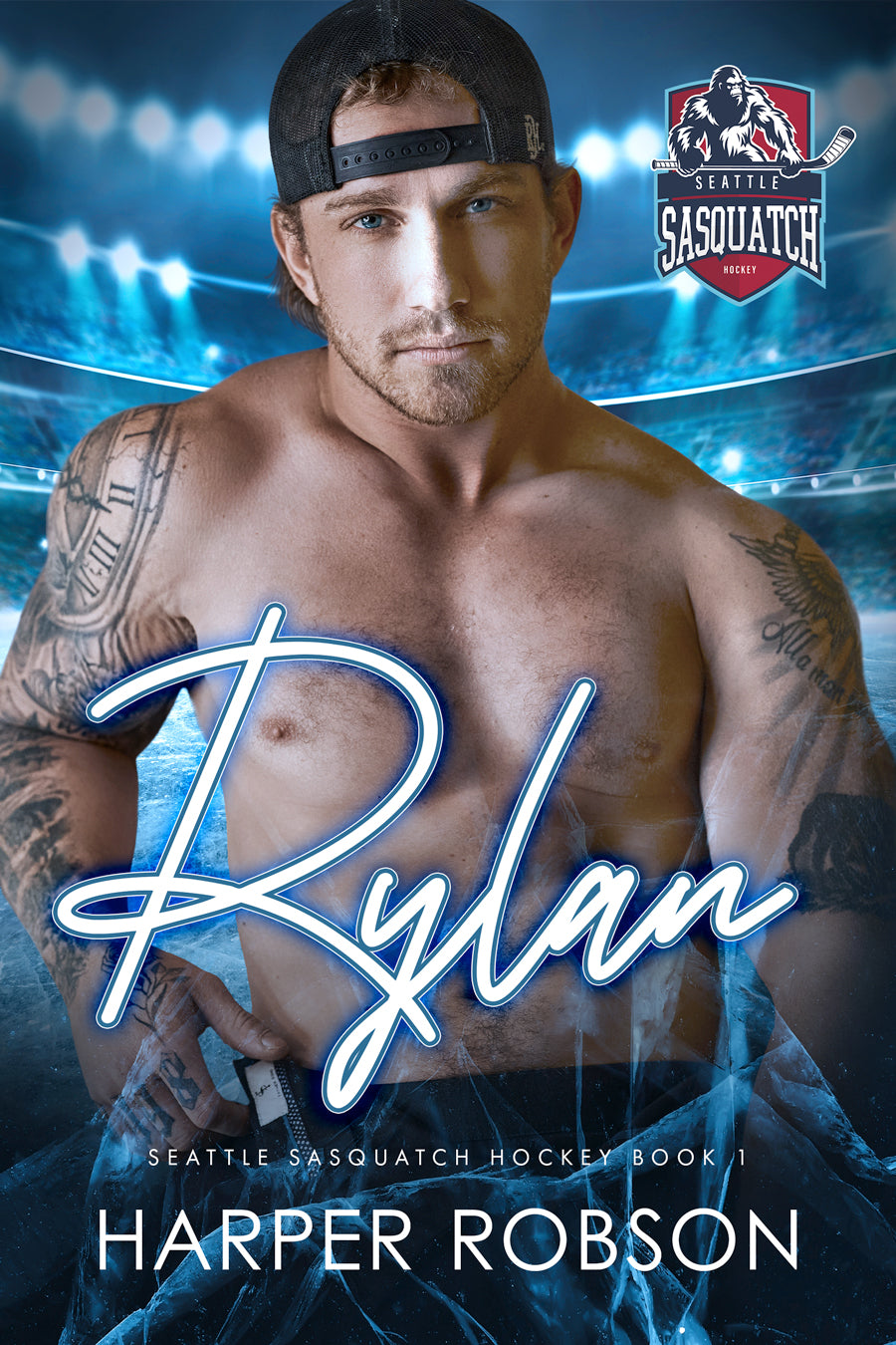 Paperback Book Cover of 'Rylan: Seattle Sasquatch Book 1' featuring a male hockey player with tattoos, wearing a backwards baseball cap. The title and author's name are prominently displayed.